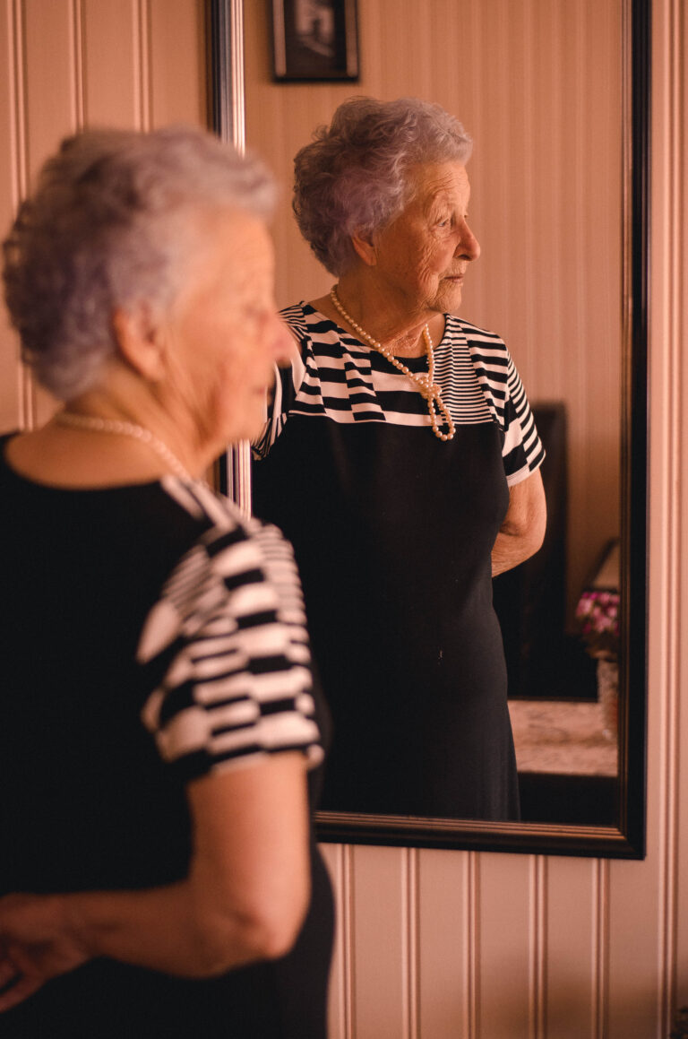 Canva Photo of Woman Standing In Front Of Mirror | Heydays Care and Support Services