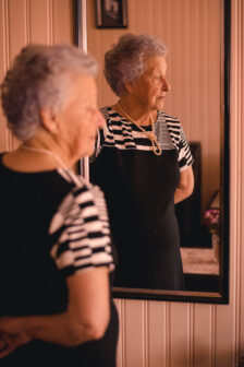 Canva Photo of Woman Standing In Front Of Mirror scaled | Heydays Care and Support Services